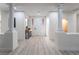 Elegant entryway with light wood floors and a modern console table at 10134 Donald Weese Ct, Las Vegas, NV 89129