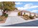 House exterior with two-car garage and landscaping at 10134 Donald Weese Ct, Las Vegas, NV 89129