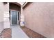 Gray front door with sidelights and a walkway at 10134 Donald Weese Ct, Las Vegas, NV 89129