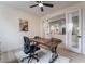 Bright home office features a large desk and access to another room at 10134 Donald Weese Ct, Las Vegas, NV 89129