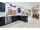 Modern kitchen with dark cabinetry and island at 10134 Donald Weese Ct, Las Vegas, NV 89129