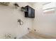 Laundry room with dark cabinets and wire shelving at 10134 Donald Weese Ct, Las Vegas, NV 89129