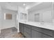 Modern bathroom with double vanity and grey cabinets at 10375 Rose Palisade St, Las Vegas, NV 89141