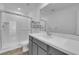 Modern bathroom with gray vanity and shower at 10375 Rose Palisade St, Las Vegas, NV 89141