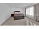 Well-lit bedroom with plush carpet and built in drawers at 10375 Rose Palisade St, Las Vegas, NV 89141