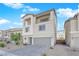 Two-story house with gray exterior and attached garage at 10375 Rose Palisade St, Las Vegas, NV 89141