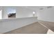 Open loft area with a wall and window at 10375 Rose Palisade St, Las Vegas, NV 89141