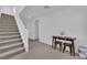 Modern staircase with gray carpeting and white railing at 10375 Rose Palisade St, Las Vegas, NV 89141