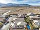 House with pool and solar panels; aerial view with mountain backdrop at 10414 Hemingway Ct, Las Vegas, NV 89149