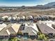 Aerial view of a house with pool, solar panels and mountain views at 10414 Hemingway Ct, Las Vegas, NV 89149