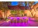 Outdoor bar with seating and lighting at 10414 Hemingway Ct, Las Vegas, NV 89149