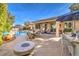 Entertaining backyard with pool, patio, and fire pit at 10414 Hemingway Ct, Las Vegas, NV 89149