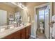 Double vanity bathroom with a separate toilet area at 10414 Hemingway Ct, Las Vegas, NV 89149