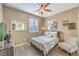 Guest bedroom with queen bed and wood-look flooring at 10414 Hemingway Ct, Las Vegas, NV 89149