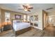 Spacious bedroom with wood flooring and mirrored closet doors at 10414 Hemingway Ct, Las Vegas, NV 89149