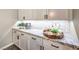 Elegant butler's pantry with granite countertops and white shaker cabinets at 10414 Hemingway Ct, Las Vegas, NV 89149