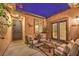 Evening view of a relaxing courtyard with seating area at 10414 Hemingway Ct, Las Vegas, NV 89149