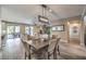 Open dining room with view of the living room and backyard at 10414 Hemingway Ct, Las Vegas, NV 89149