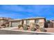 Single-story home with two-car garage and landscaped yard at 10414 Hemingway Ct, Las Vegas, NV 89149