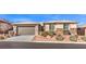 Single-story home with two-car garage and landscaped yard at 10414 Hemingway Ct, Las Vegas, NV 89149