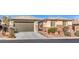 Single-story home with two-car garage and landscaped yard at 10414 Hemingway Ct, Las Vegas, NV 89149