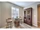 Game room with a rustic barrel table and dartboard cabinet at 10414 Hemingway Ct, Las Vegas, NV 89149