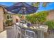 Stylish outdoor kitchen with bar seating at 10414 Hemingway Ct, Las Vegas, NV 89149