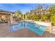 Inviting pool with water feature and patio seating at 10414 Hemingway Ct, Las Vegas, NV 89149