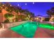 Modern, rectangular pool with spa and lighting at 10414 Hemingway Ct, Las Vegas, NV 89149