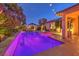 Lighted rectangular pool and spa at 10414 Hemingway Ct, Las Vegas, NV 89149