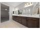 Large bathroom with double vanity and walk in shower at 1070 Kelly Brook Ln, Henderson, NV 89011