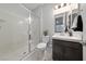 Bathroom with walk-in shower and dark brown vanity at 1070 Kelly Brook Ln, Henderson, NV 89011