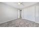 Well-lit bedroom with grey carpet and closet at 1070 Kelly Brook Ln, Henderson, NV 89011