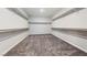 Large walk-in closet with double hanging rods and shelving at 1070 Kelly Brook Ln, Henderson, NV 89011