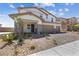 Two-story house with three-car garage and nicely landscaped front yard at 1070 Kelly Brook Ln, Henderson, NV 89011