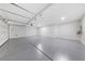 Two-car garage with epoxy flooring and extra storage space at 1070 Kelly Brook Ln, Henderson, NV 89011