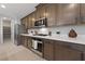 Modern kitchen features stainless steel appliances and ample wood cabinets at 1070 Kelly Brook Ln, Henderson, NV 89011