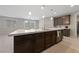 Modern kitchen with large island and stainless steel appliances at 1070 Kelly Brook Ln, Henderson, NV 89011