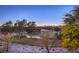 Aerial view of lush green golf course with mature trees at 1705 Corta Bella Dr, Las Vegas, NV 89134