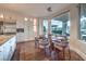 A well-lit dining area features a modern table and chairs and scenic views through a large window at 1705 Corta Bella Dr, Las Vegas, NV 89134