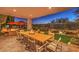 Large patio with seating for dining and fire pit at 1705 Corta Bella Dr, Las Vegas, NV 89134