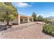 Landscaped backyard with patio and golf course view at 1717 Warrington Dr, Henderson, NV 89052