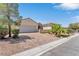 One-story house with a large driveway and mature landscaping at 1717 Warrington Dr, Henderson, NV 89052