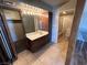 Bathroom with vanity, large mirror, and access to another bathroom at 1925 E Saint Louis Ave, Las Vegas, NV 89104