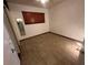 Bedroom with tile floors and a window with blinds at 1925 E Saint Louis Ave, Las Vegas, NV 89104