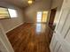 Bright bedroom featuring hardwood floors and sliding glass doors at 1925 E Saint Louis Ave, Las Vegas, NV 89104