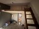 Upstairs loft bedroom with access via ladder at 1925 E Saint Louis Ave, Las Vegas, NV 89104