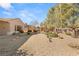 Landscaped backyard with gravel and desert plants at 2000 Poppywood Ave, Henderson, NV 89012