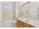 Bathroom with tub, single sink, and wood vanity at 2000 Poppywood Ave, Henderson, NV 89012