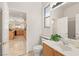 Bright bathroom with updated vanity and view of kitchen at 2000 Poppywood Ave, Henderson, NV 89012